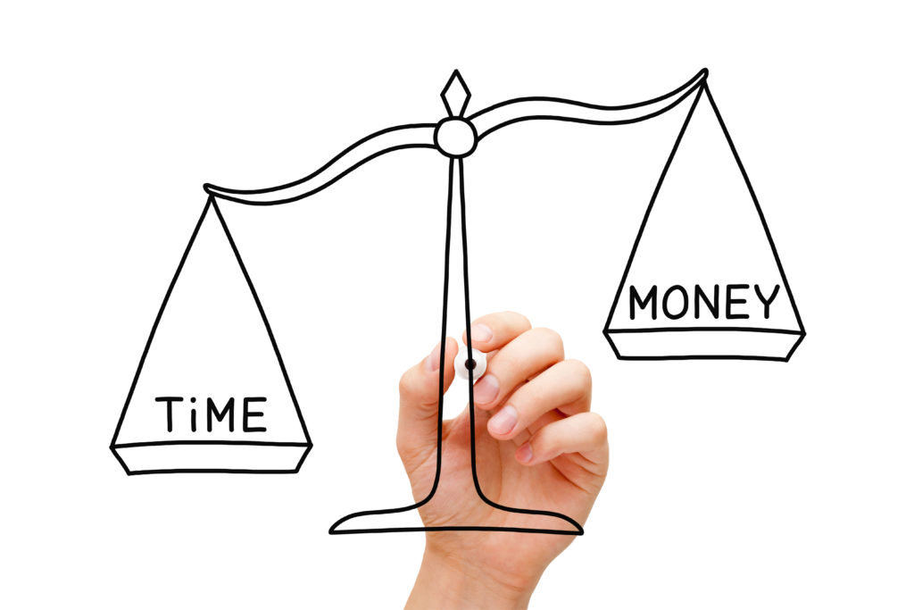 hand sketching a scale weighing time vs money 